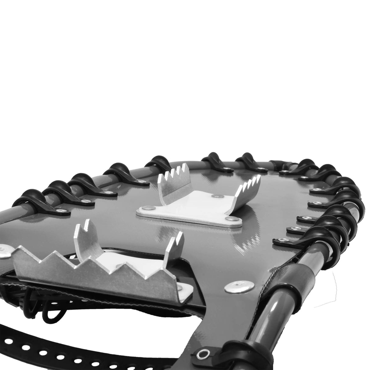 Bottom view of Backpacker snowshoes showing crampons and traction spikes