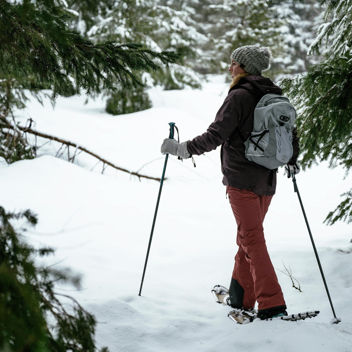 Person snowshoeing in deep snow wearing Quicksilver 25 snowshoes