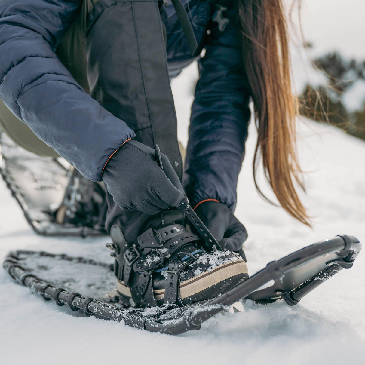Backpacker snowshoes in action on deep snow during winter backpacking trip