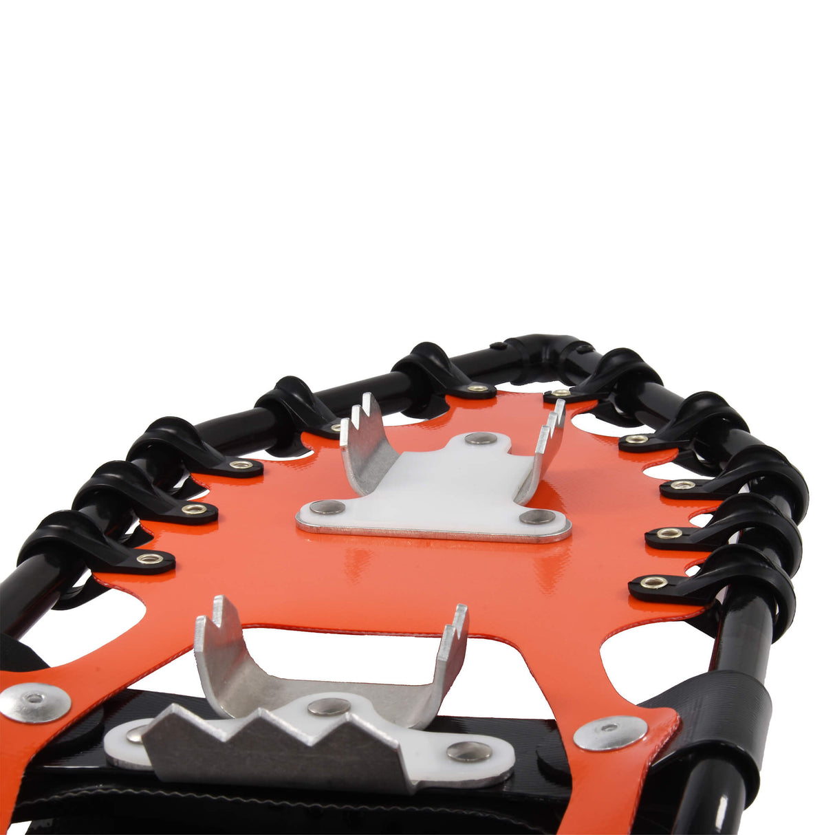 Close-up of orange Race Wave snowshoe traction system and crampons