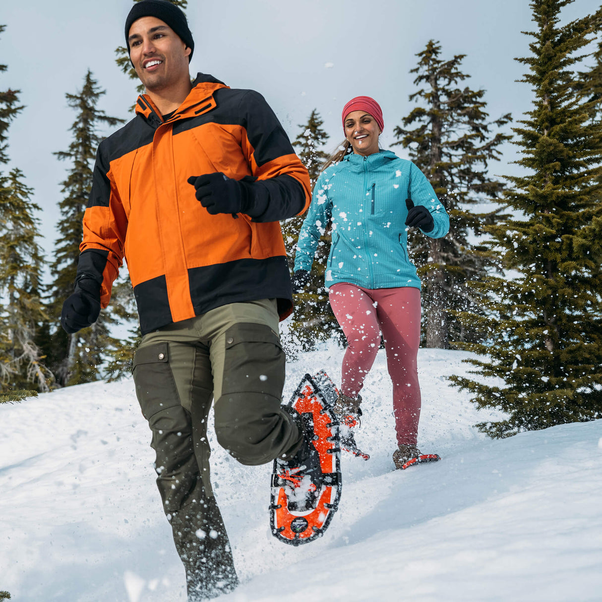Snowshoe racer sprinting in winter race wearing ultralight running snowshoes