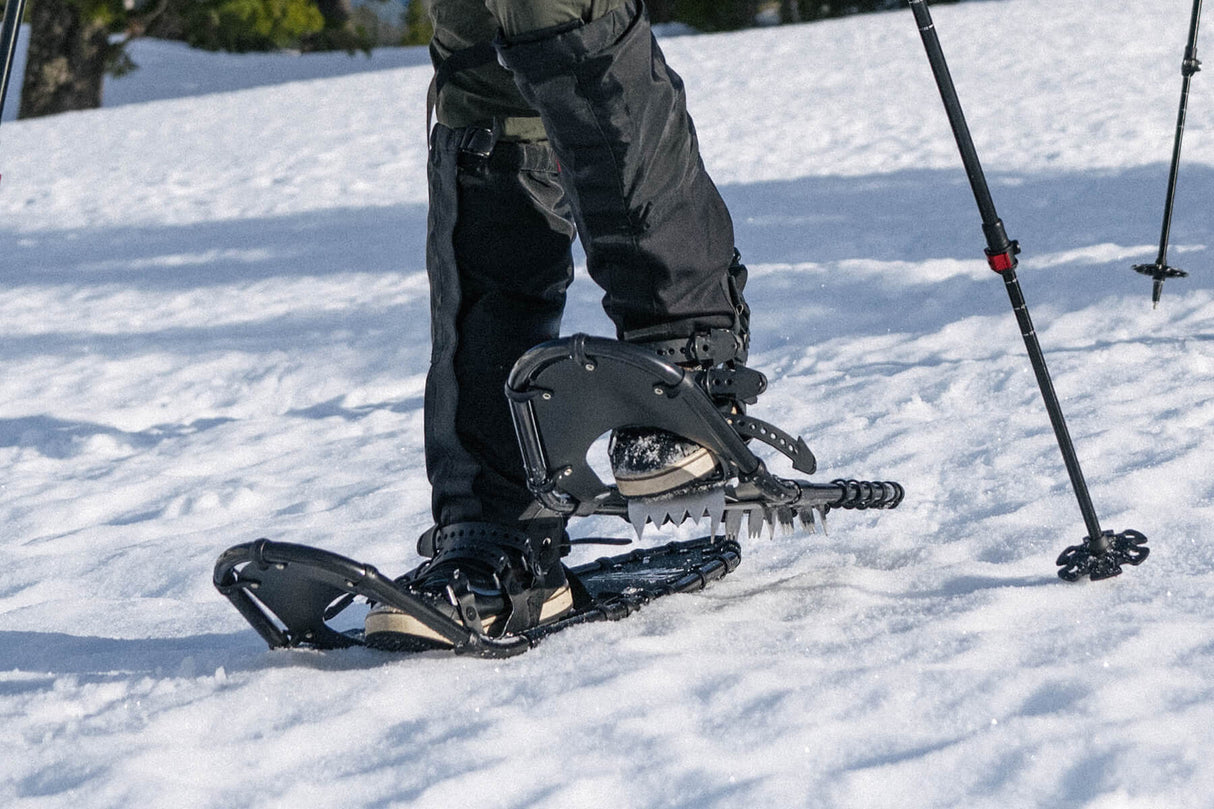 Backcountry hiker using Timber Wolf snowshoes in rugged winter terrain