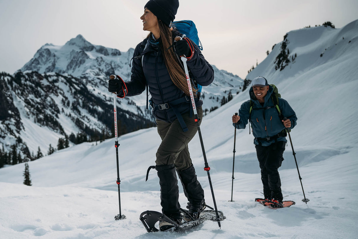 Snowshoer standing in mountain snow wearing Timber Wolf extreme terrain snowshoes